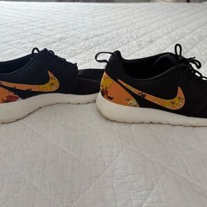 Nike Black and Orange Cartoon Athletic Shoes